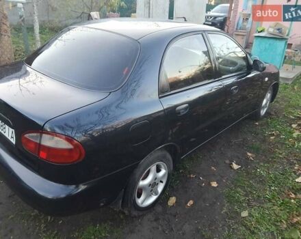Черный Дэу Ланос, объемом двигателя 1.5 л и пробегом 256 тыс. км за 1850 $, фото 1 на Automoto.ua