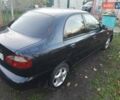 Черный Дэу Ланос, объемом двигателя 1.5 л и пробегом 256 тыс. км за 1850 $, фото 1 на Automoto.ua