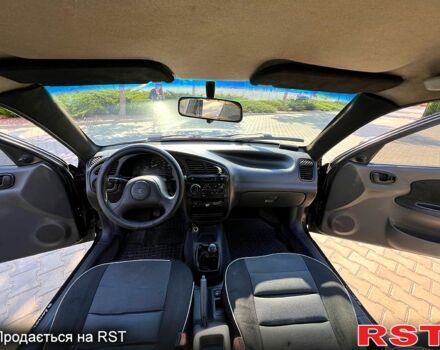 Черный Дэу Ланос, объемом двигателя 1.5 л и пробегом 183 тыс. км за 2600 $, фото 6 на Automoto.ua
