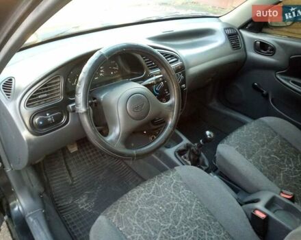 Черный Дэу Ланос, объемом двигателя 1.5 л и пробегом 231 тыс. км за 1999 $, фото 8 на Automoto.ua