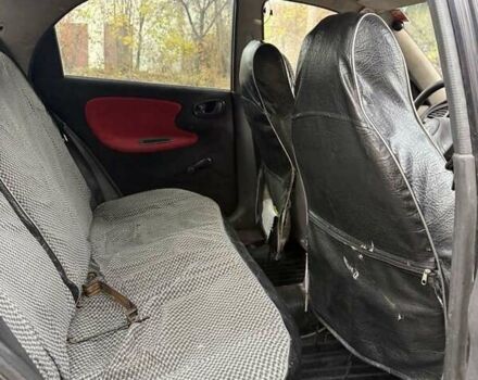 Черный Дэу Ланос, объемом двигателя 1.5 л и пробегом 100 тыс. км за 900 $, фото 18 на Automoto.ua