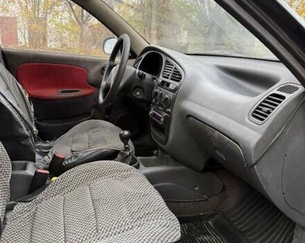 Черный Дэу Ланос, объемом двигателя 1.5 л и пробегом 100 тыс. км за 900 $, фото 10 на Automoto.ua