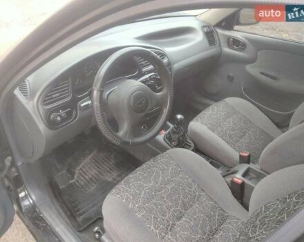 Черный Дэу Ланос, объемом двигателя 1.5 л и пробегом 200 тыс. км за 1550 $, фото 7 на Automoto.ua