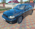 Черный Дэу Ланос, объемом двигателя 1.5 л и пробегом 226 тыс. км за 1450 $, фото 1 на Automoto.ua