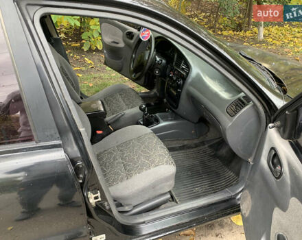 Черный Дэу Ланос, объемом двигателя 1.5 л и пробегом 263 тыс. км за 1830 $, фото 6 на Automoto.ua