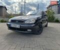 Черный Дэу Ланос, объемом двигателя 1.5 л и пробегом 216 тыс. км за 1850 $, фото 1 на Automoto.ua