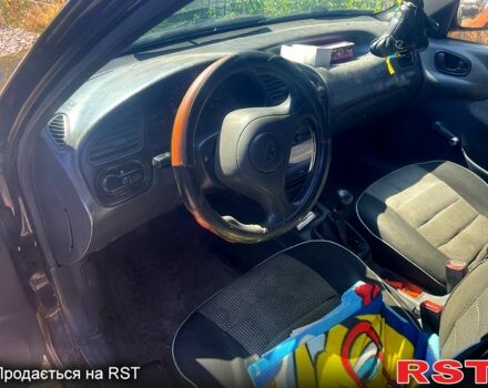 Чорний Деу Ланос, об'ємом двигуна 1.5 л та пробігом 200 тис. км за 2000 $, фото 4 на Automoto.ua