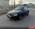 Черный Дэу Ланос, объемом двигателя 1.5 л и пробегом 250 тыс. км за 1450 $, фото 1 на Automoto.ua