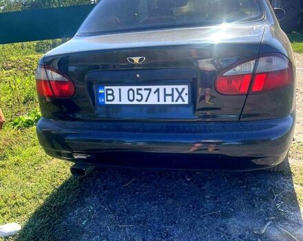 Черный Дэу Ланос, объемом двигателя 1.5 л и пробегом 300 тыс. км за 3300 $, фото 1 на Automoto.ua