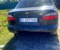 Черный Дэу Ланос, объемом двигателя 1.5 л и пробегом 300 тыс. км за 3300 $, фото 1 на Automoto.ua