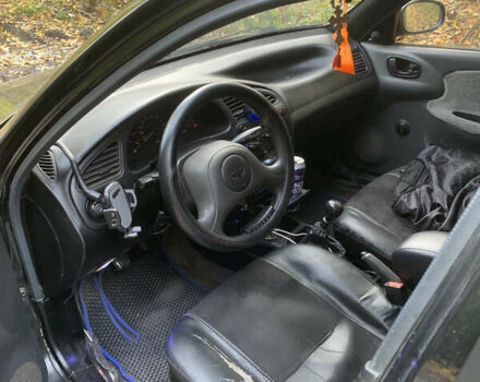 Черный Дэу Ланос, объемом двигателя 1.5 л и пробегом 290 тыс. км за 1600 $, фото 5 на Automoto.ua