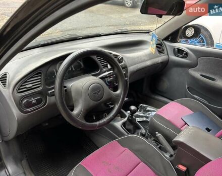 Чорний Деу Ланос, об'ємом двигуна 1.5 л та пробігом 222 тис. км за 1800 $, фото 16 на Automoto.ua