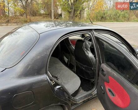 Черный Дэу Ланос, объемом двигателя 1.5 л и пробегом 100 тыс. км за 900 $, фото 14 на Automoto.ua