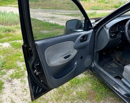 Черный Дэу Ланос, объемом двигателя 1.5 л и пробегом 250 тыс. км за 1400 $, фото 7 на Automoto.ua