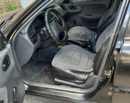 Чорний Деу Ланос, об'ємом двигуна 1.5 л та пробігом 371 тис. км за 2100 $, фото 1 на Automoto.ua