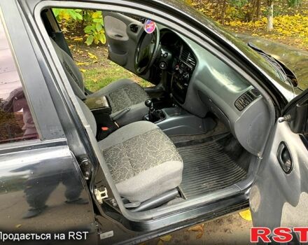 Черный Дэу Ланос, объемом двигателя 1.5 л и пробегом 256 тыс. км за 2600 $, фото 7 на Automoto.ua