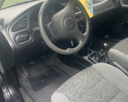 Черный Дэу Ланос, объемом двигателя 1.5 л и пробегом 179 тыс. км за 2300 $, фото 4 на Automoto.ua