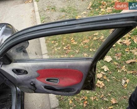 Черный Дэу Ланос, объемом двигателя 1.5 л и пробегом 100 тыс. км за 900 $, фото 11 на Automoto.ua