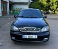 Чорний Деу Ланос, об'ємом двигуна 1.5 л та пробігом 0 тис. км за 2000 $, фото 1 на Automoto.ua