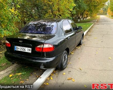 Черный Дэу Ланос, объемом двигателя 1.5 л и пробегом 256 тыс. км за 2600 $, фото 2 на Automoto.ua
