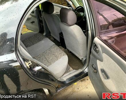 Черный Дэу Ланос, объемом двигателя 1.5 л и пробегом 256 тыс. км за 2600 $, фото 8 на Automoto.ua