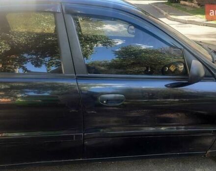 Черный Дэу Ланос, объемом двигателя 1.5 л и пробегом 110 тыс. км за 1500 $, фото 12 на Automoto.ua