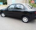 Черный Дэу Ланос, объемом двигателя 1.5 л и пробегом 200 тыс. км за 1999 $, фото 7 на Automoto.ua