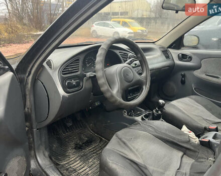 Черный Дэу Ланос, объемом двигателя 1.5 л и пробегом 298 тыс. км за 1000 $, фото 11 на Automoto.ua