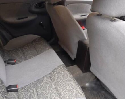 Черный Дэу Ланос, объемом двигателя 1.5 л и пробегом 272 тыс. км за 2000 $, фото 5 на Automoto.ua