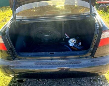 Черный Дэу Ланос, объемом двигателя 1.5 л и пробегом 300 тыс. км за 3300 $, фото 2 на Automoto.ua