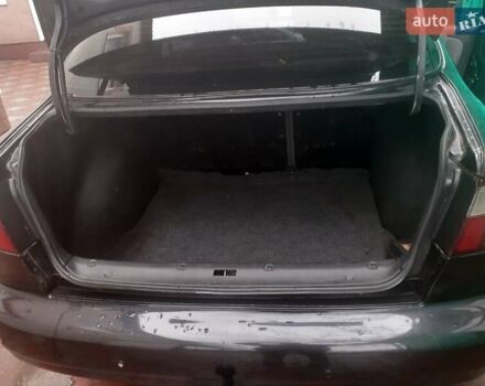 Черный Дэу Ланос, объемом двигателя 1.5 л и пробегом 94 тыс. км за 2800 $, фото 3 на Automoto.ua