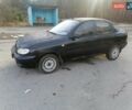 Черный Дэу Ланос, объемом двигателя 1.5 л и пробегом 300 тыс. км за 1650 $, фото 1 на Automoto.ua