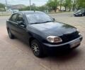Черный Дэу Ланос, объемом двигателя 1.5 л и пробегом 280 тыс. км за 1550 $, фото 1 на Automoto.ua