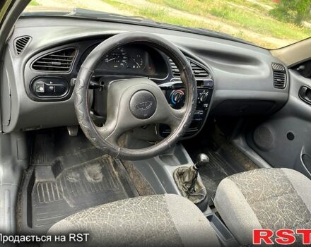 Черный Дэу Ланос, объемом двигателя 1.5 л и пробегом 250 тыс. км за 1400 $, фото 6 на Automoto.ua