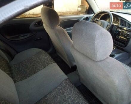 Черный Дэу Ланос, объемом двигателя 1.5 л и пробегом 231 тыс. км за 1999 $, фото 12 на Automoto.ua