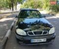 Черный Дэу Ланос, объемом двигателя 1.5 л и пробегом 263 тыс. км за 1900 $, фото 1 на Automoto.ua