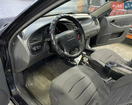 Черный Дэу Ланос, объемом двигателя 1.5 л и пробегом 145 тыс. км за 1799 $, фото 6 на Automoto.ua