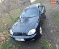 Черный Дэу Ланос, объемом двигателя 1.5 л и пробегом 256 тыс. км за 1850 $, фото 1 на Automoto.ua