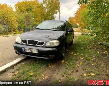 Черный Дэу Ланос, объемом двигателя 1.5 л и пробегом 256 тыс. км за 2600 $, фото 1 на Automoto.ua