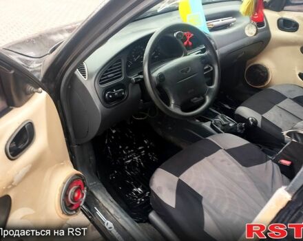 Черный Дэу Ланос, объемом двигателя 1.6 л и пробегом 200 тыс. км за 1600 $, фото 6 на Automoto.ua