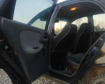 Черный Дэу Ланос, объемом двигателя 1.4 л и пробегом 140 тыс. км за 2200 $, фото 7 на Automoto.ua