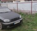 Черный Дэу Ланос, объемом двигателя 1.5 л и пробегом 248 тыс. км за 1500 $, фото 1 на Automoto.ua