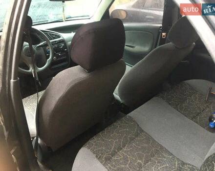 Чорний Деу Ланос, об'ємом двигуна 1.39 л та пробігом 200 тис. км за 900 $, фото 1 на Automoto.ua