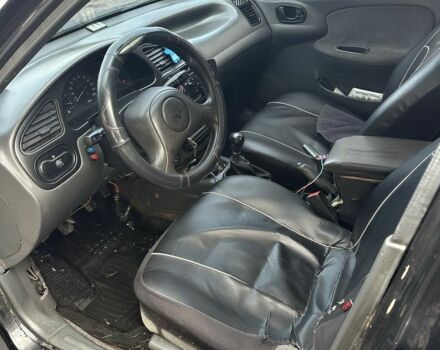 Черный Дэу Ланос, объемом двигателя 1.5 л и пробегом 150 тыс. км за 1700 $, фото 8 на Automoto.ua