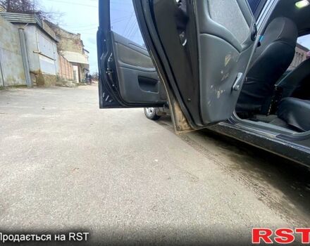 Черный Дэу Ланос, объемом двигателя 1.5 л и пробегом 220 тыс. км за 1350 $, фото 4 на Automoto.ua