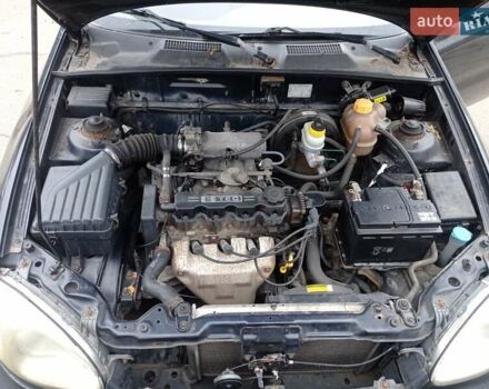 Черный Дэу Ланос, объемом двигателя 1.5 л и пробегом 141 тыс. км за 1700 $, фото 11 на Automoto.ua