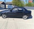 Чорний Деу Ланос, об'ємом двигуна 1.5 л та пробігом 177 тис. км за 2000 $, фото 1 на Automoto.ua