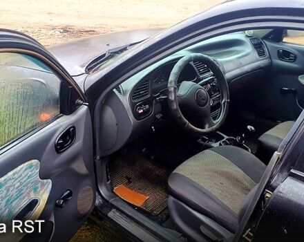 Черный Дэу Ланос, объемом двигателя 1.6 л и пробегом 200 тыс. км за 1700 $, фото 3 на Automoto.ua