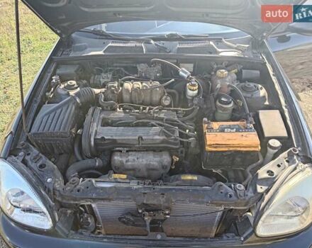 Черный Дэу Ланос, объемом двигателя 1.6 л и пробегом 271 тыс. км за 2000 $, фото 13 на Automoto.ua