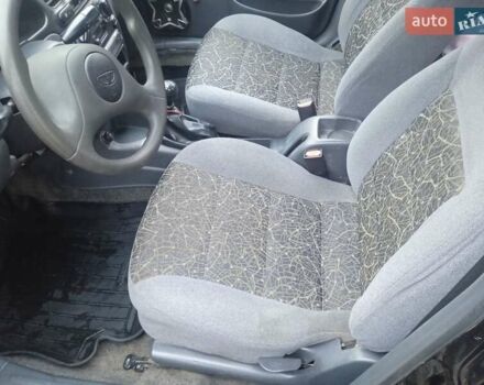 Черный Дэу Ланос, объемом двигателя 1.5 л и пробегом 230 тыс. км за 2350 $, фото 8 на Automoto.ua